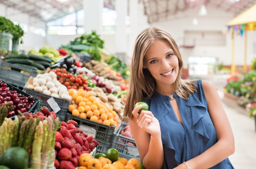 benefits of shopping local - woman shopping for organic fruits and vegetables