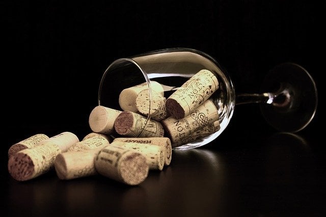 cork recycling - glass full of corks