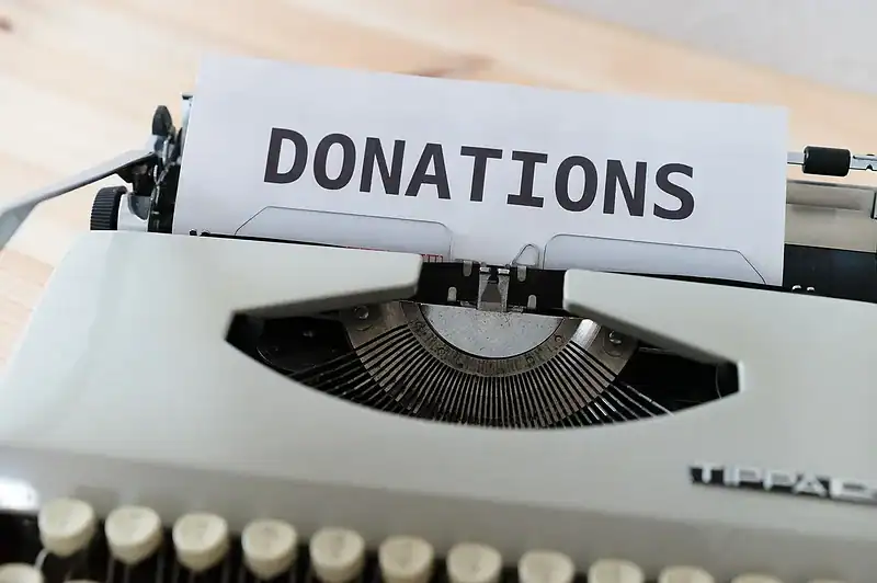 donate bedding to animal shelter featured image - typewriter typing donations